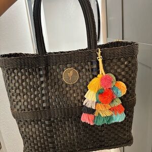 Elegant Black Woven Tote Bag with Colorful Tassels